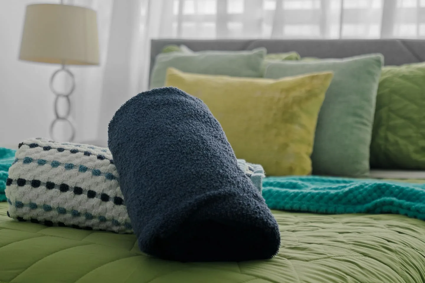 Bedroom with a blue towel on the bed — Maré 2BR | Near Ocean Park Beach + Laundry, Santurce
