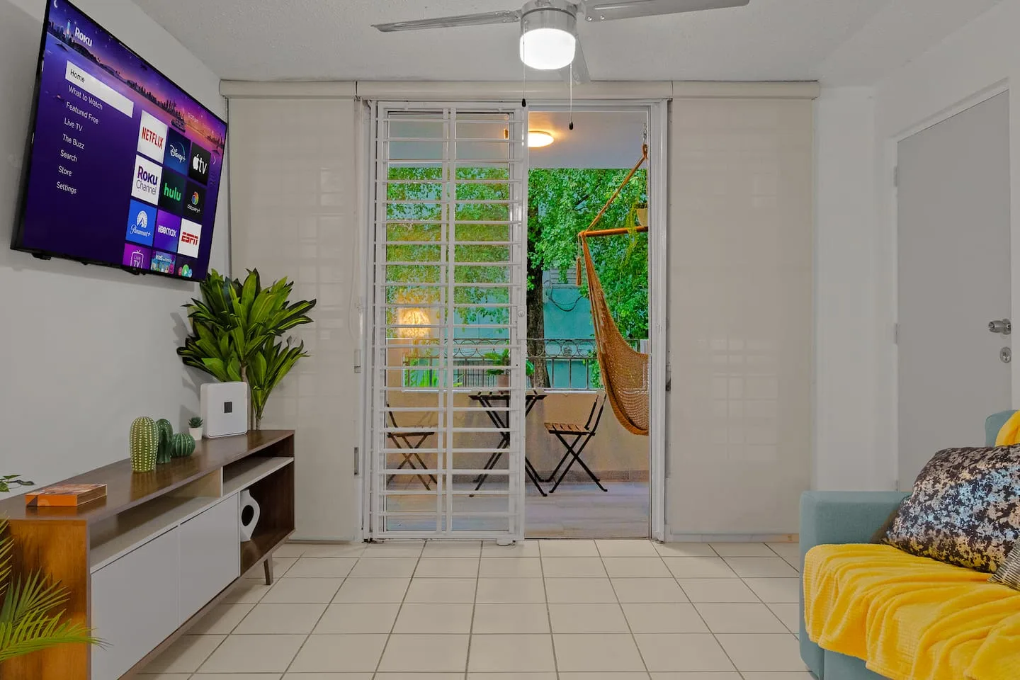 View of a patio with a hammock and a table — San Juan 2BR | Sleeps 7 + Balcony & Laundry, Santurce