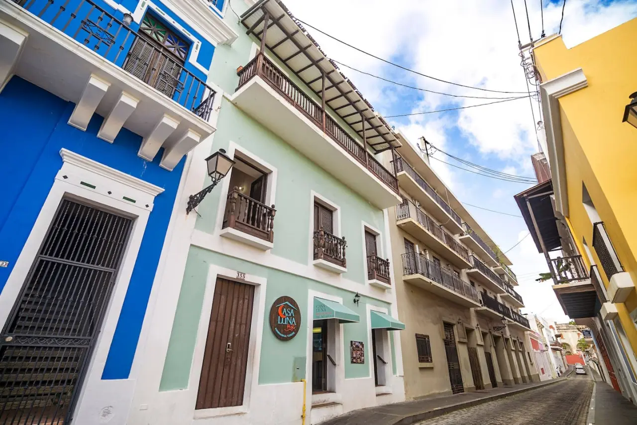 Blue and white building with a balcony — Sunset Haven | Ocean Breeze | Old San Juan
