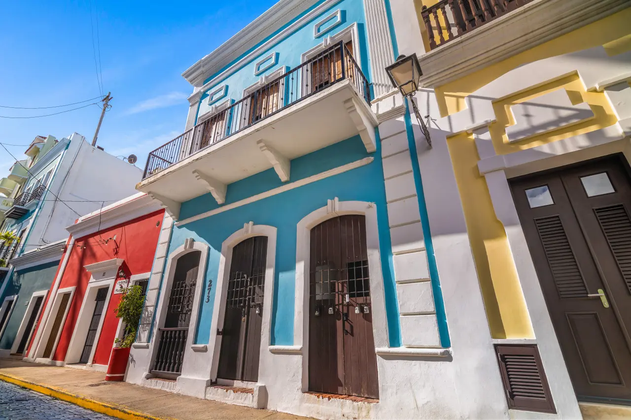 Blue and white building with a balcony — Morocco Loft Sanjuanero | Viejo San Juan, Old San Juan