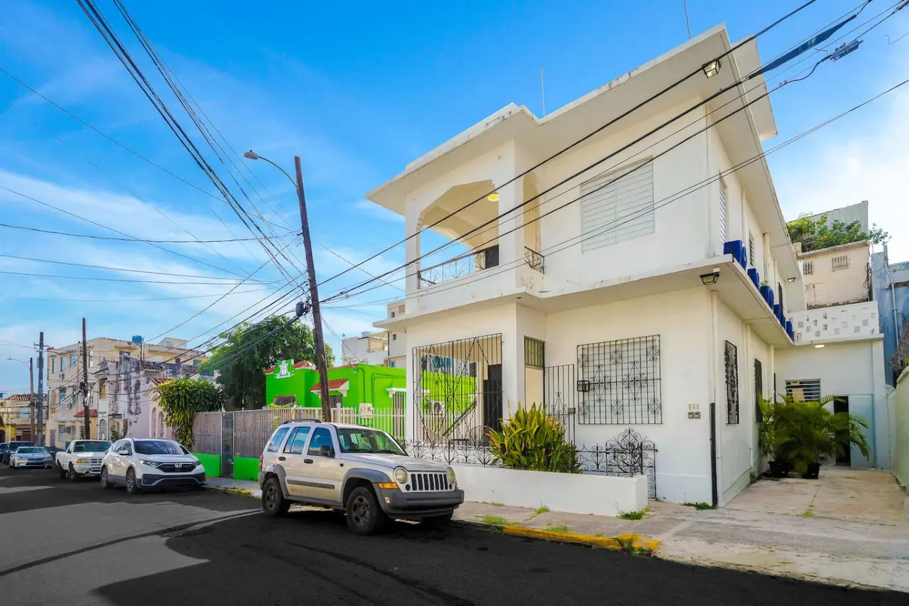 White two-story building on a street corner — Downtown San Juan Gateway Dream, Santurce