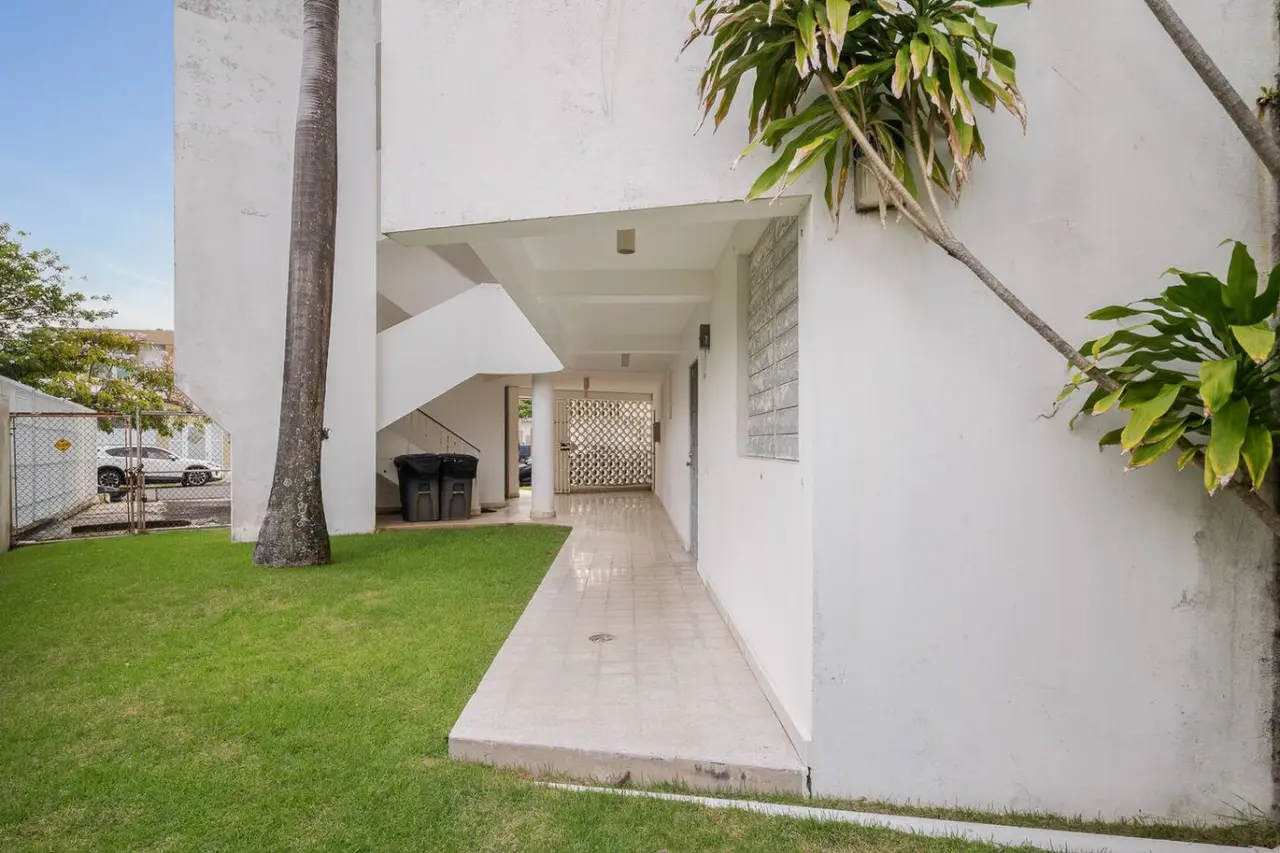 Building's lawn and open stairway with palms — Punta Las Marias Studio - Short Walk to the Beach, Santurce