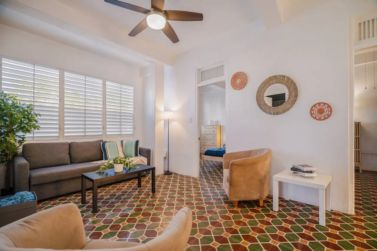 Living room with a couch, chair, and table — Tapia Mosaic Beachwalk - San Juan, Santurce