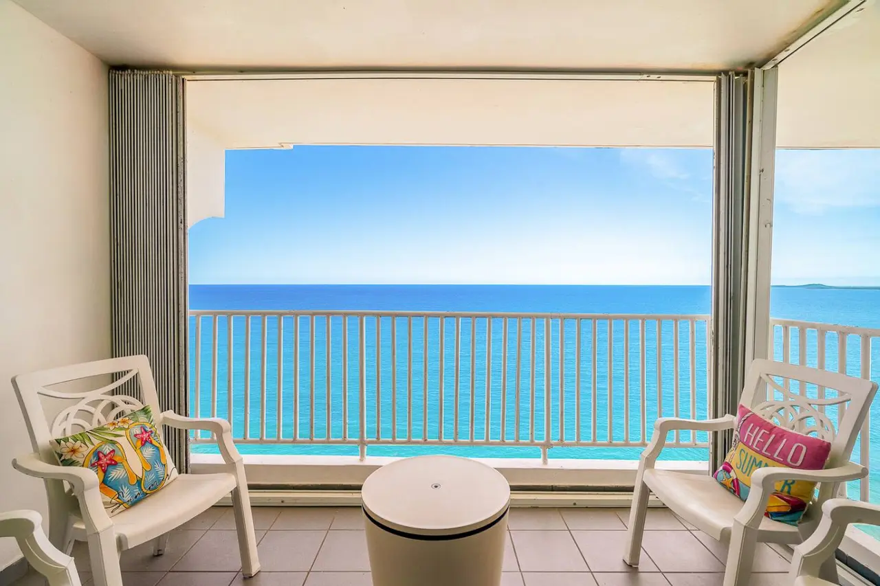 Balcony with two armchairs facing the ocean — Captain’s Beachfront Luquillo Beach House