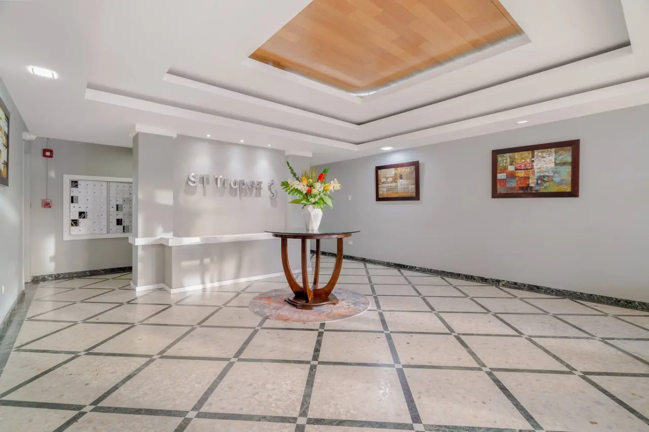Building lobby with a patterned marble floor — OceanSide - Pool Balcony, Isla Verde
