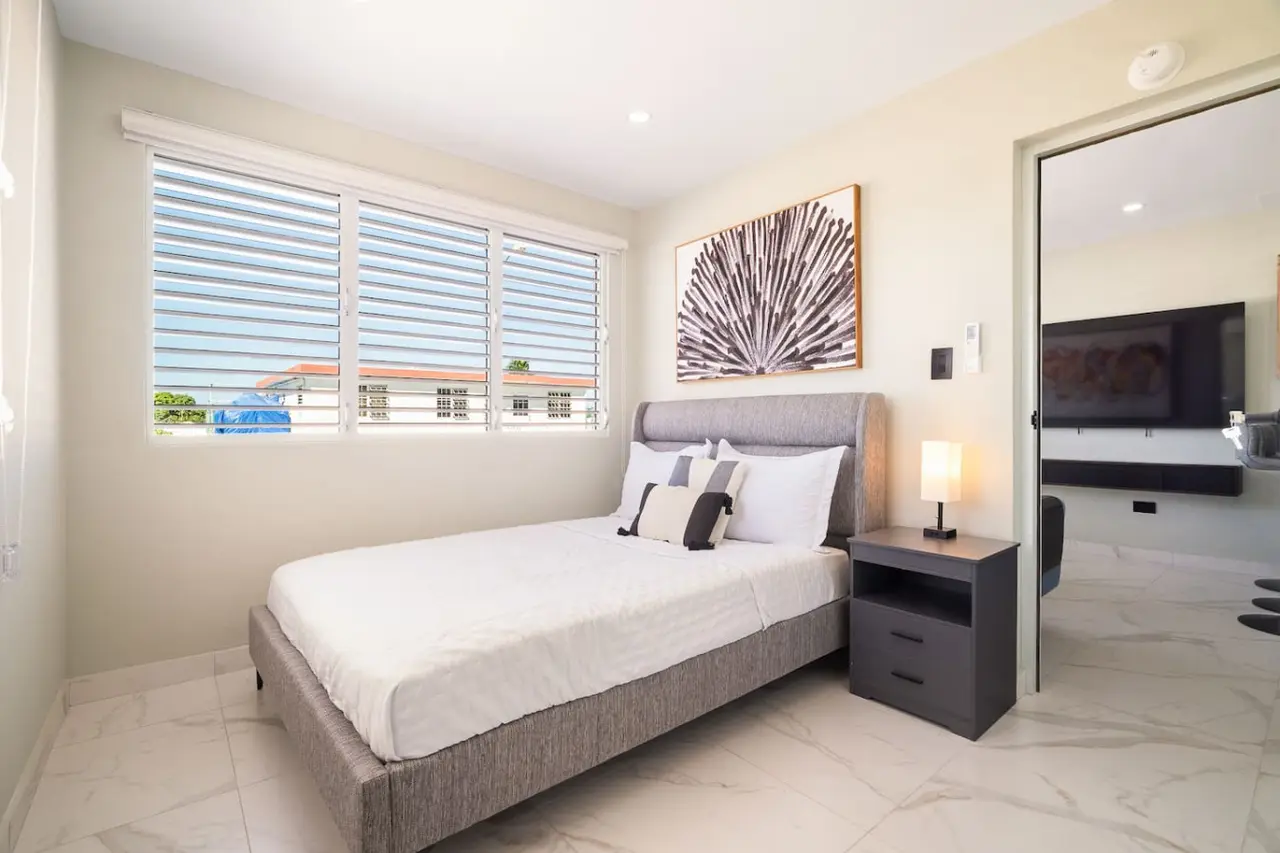 Bedroom with a large bed — MoonJoy Chic 2BR Apartment Private Patio, Carolina