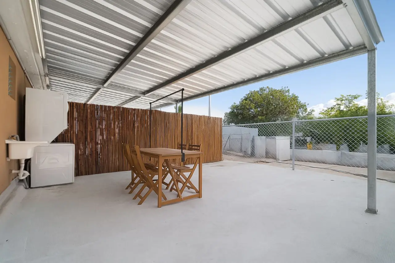 Wooden table and chairs on a patio — MoonJoy Chic 2BR Apartment Private Patio, Carolina