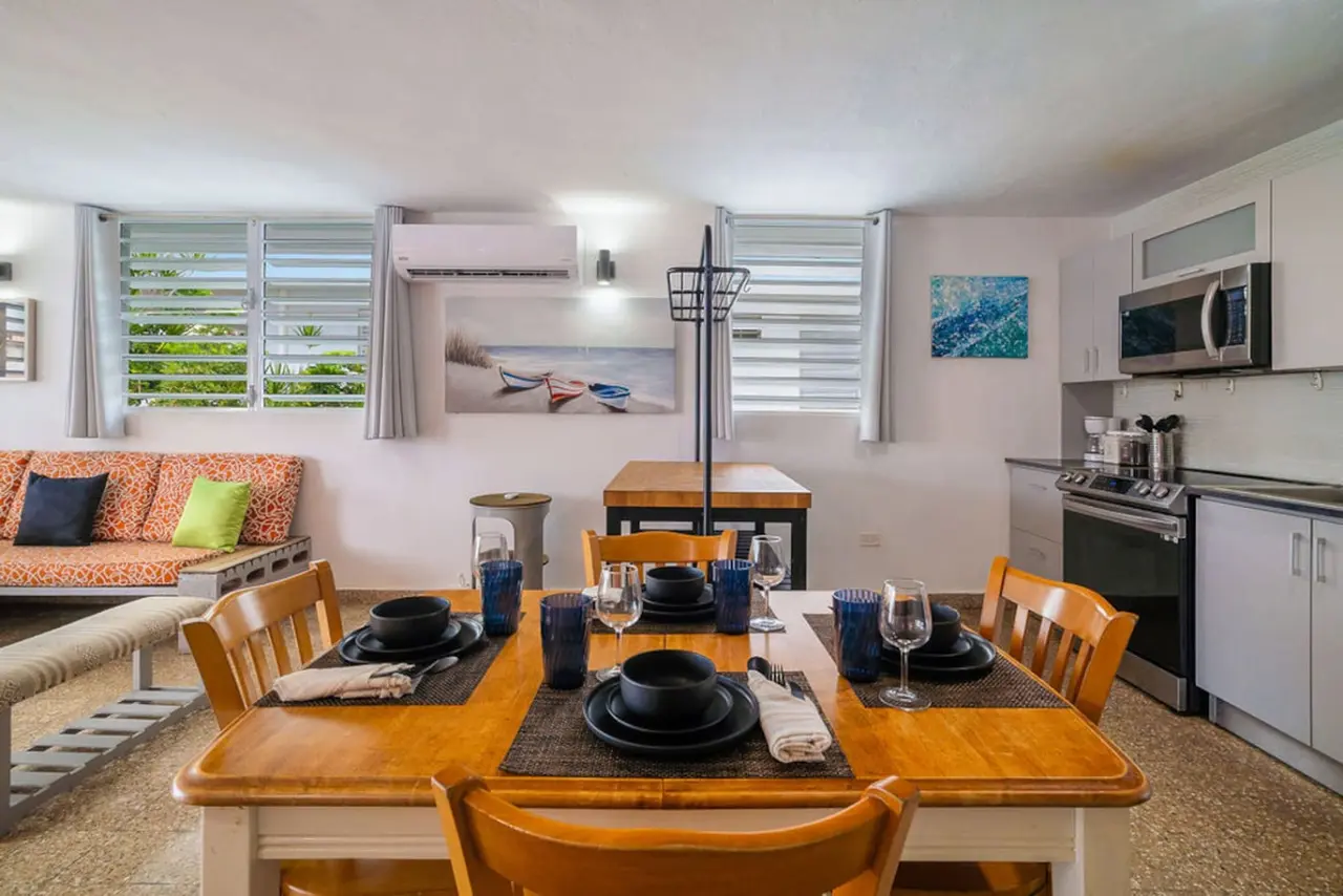 Table set for dinner with wine glasses and plates — Walking to the Beach 3 bedroom House Next to Ocean, Luquillo
