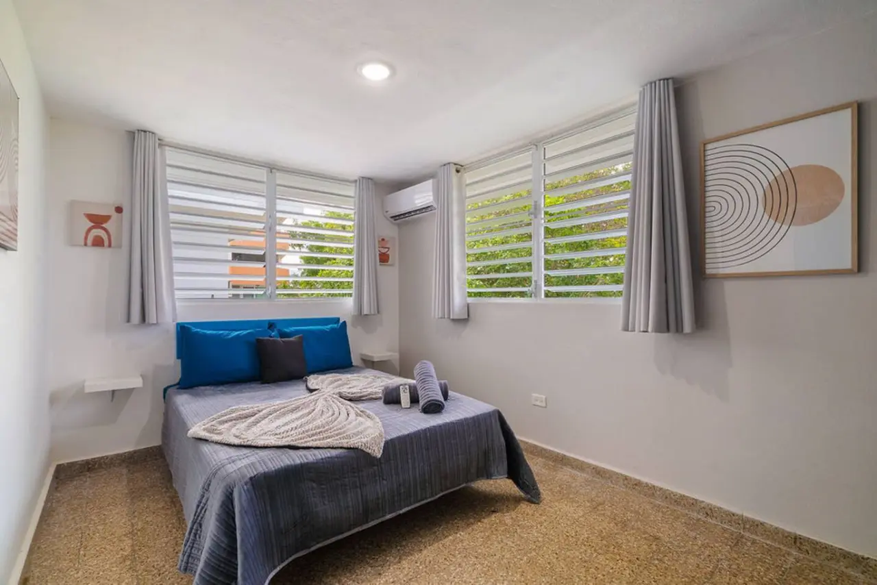 Bedroom with a blue bedspread — Walking to the Beach 3 bedroom House Next to Ocean, Luquillo