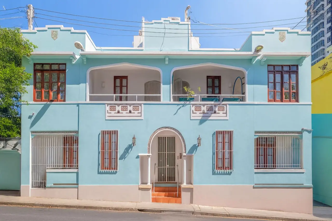 Blue and white building with a balcony — Historical Old San Juan Spanish style private Patio