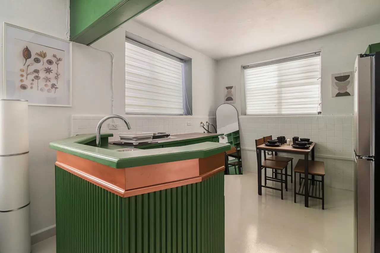 Kitchen with a green counter top and a sink — Puerto Lagoon Downtown, Santurce