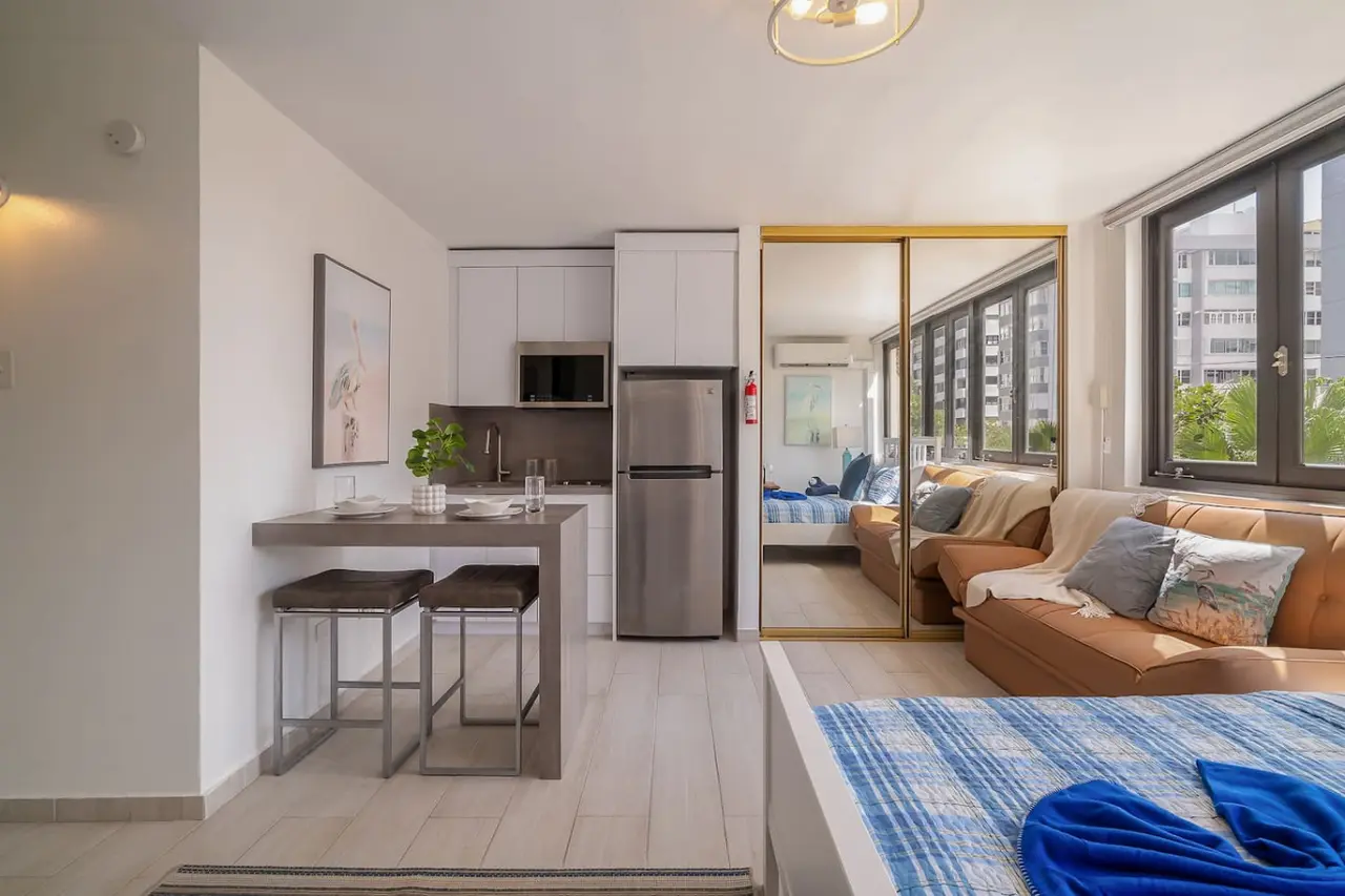 Kitchen with a refrigerator, stove, and sink — Luxe Beachside Oasis: Pool Parking & Generator, Santurce