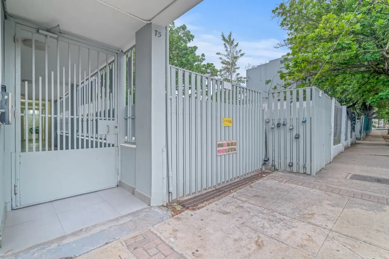 Gated entrance of the building from the sidewalk — High-Rise Condado Suite | Ocean Views & PR Skyline