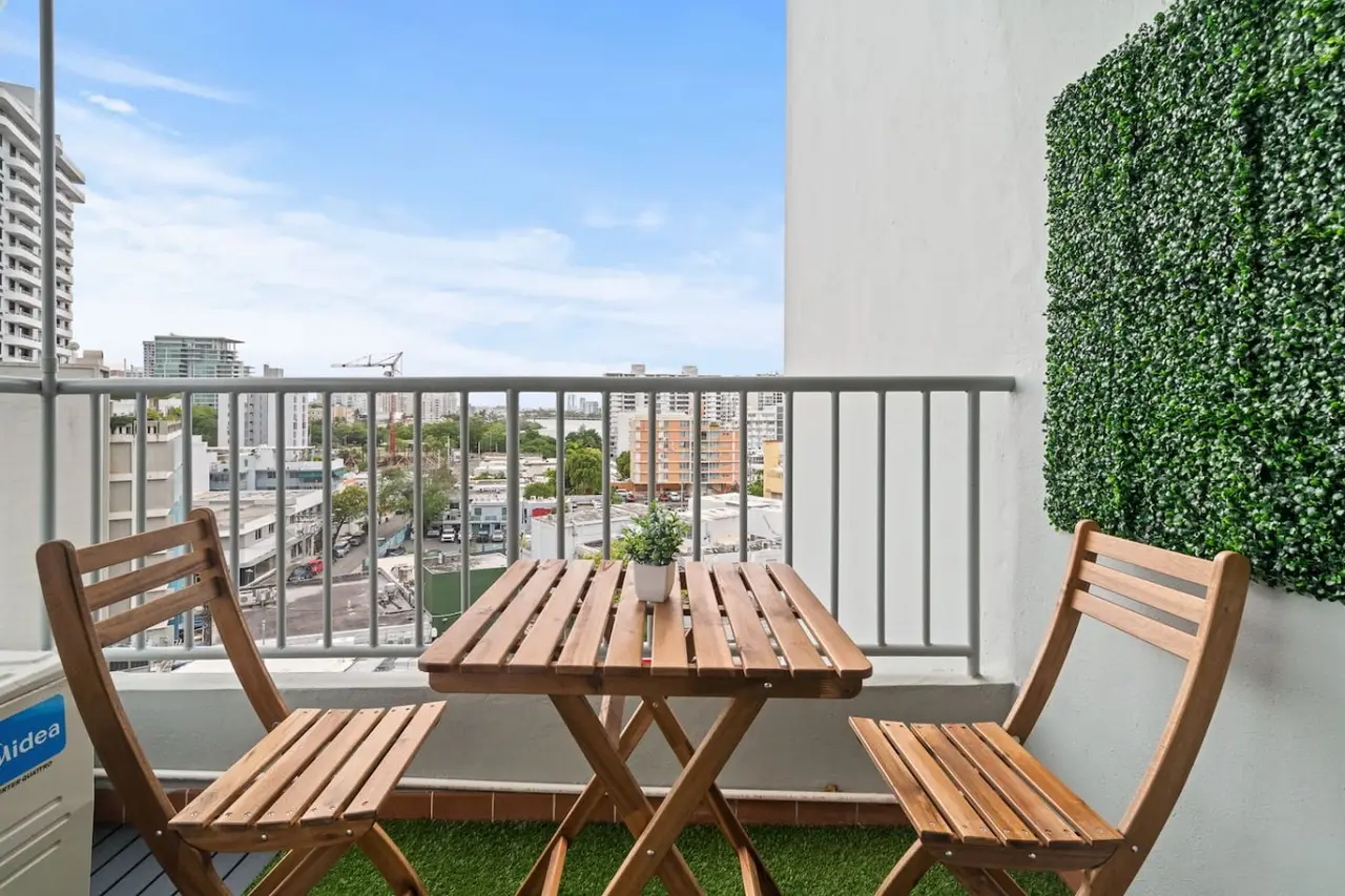 Balcony overlooking the city — High-Rise Condado Suite | Ocean Views & PR Skyline