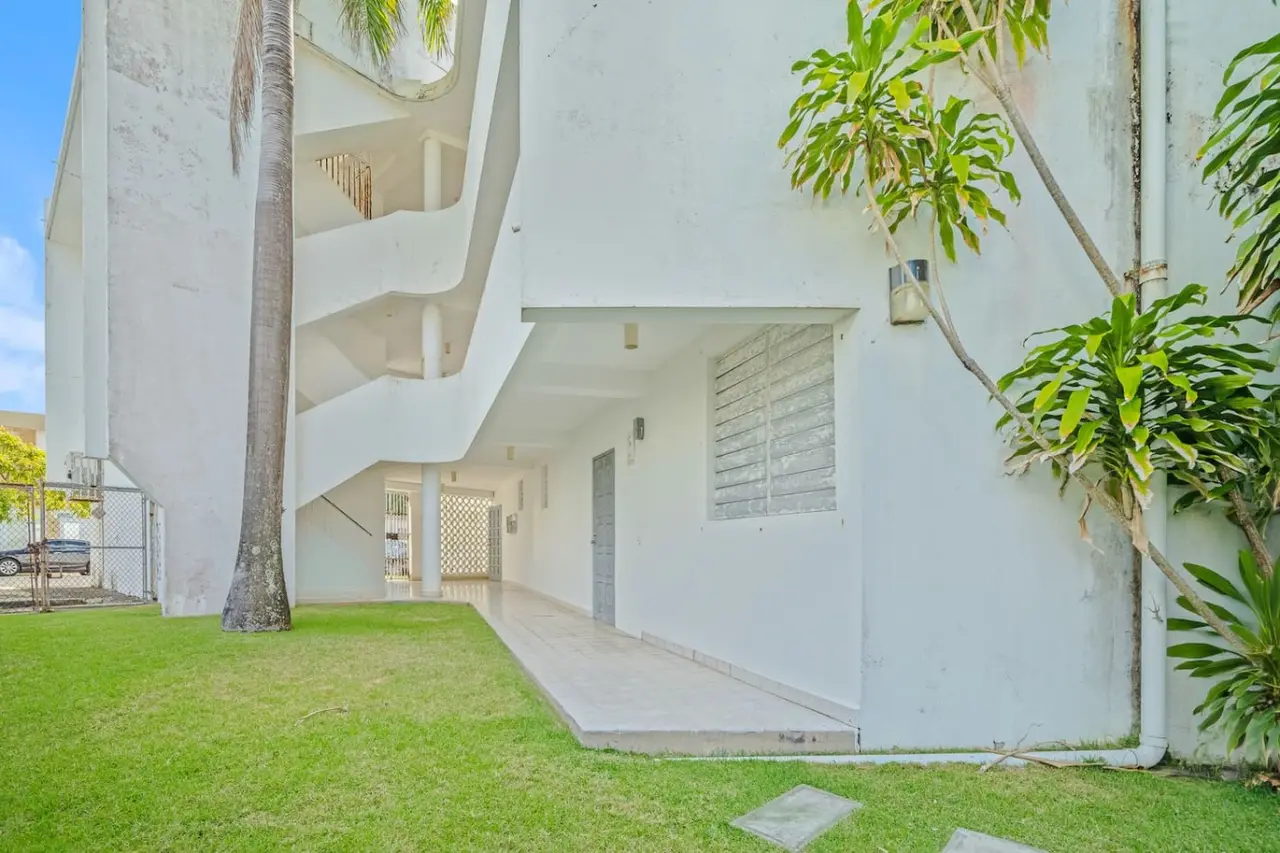 Building's garden side with an open stairway — Ocean Park 2BR · Steps to Beach & Dining, Santurce
