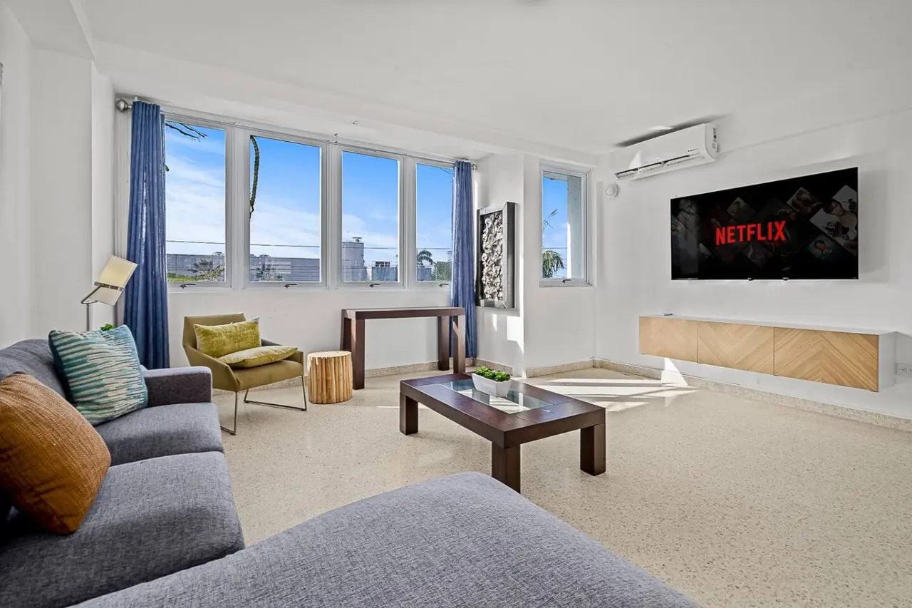 Living room with a couch and a flat screen TV — Ocean Park 2BR · Steps to Beach & Dining, Santurce