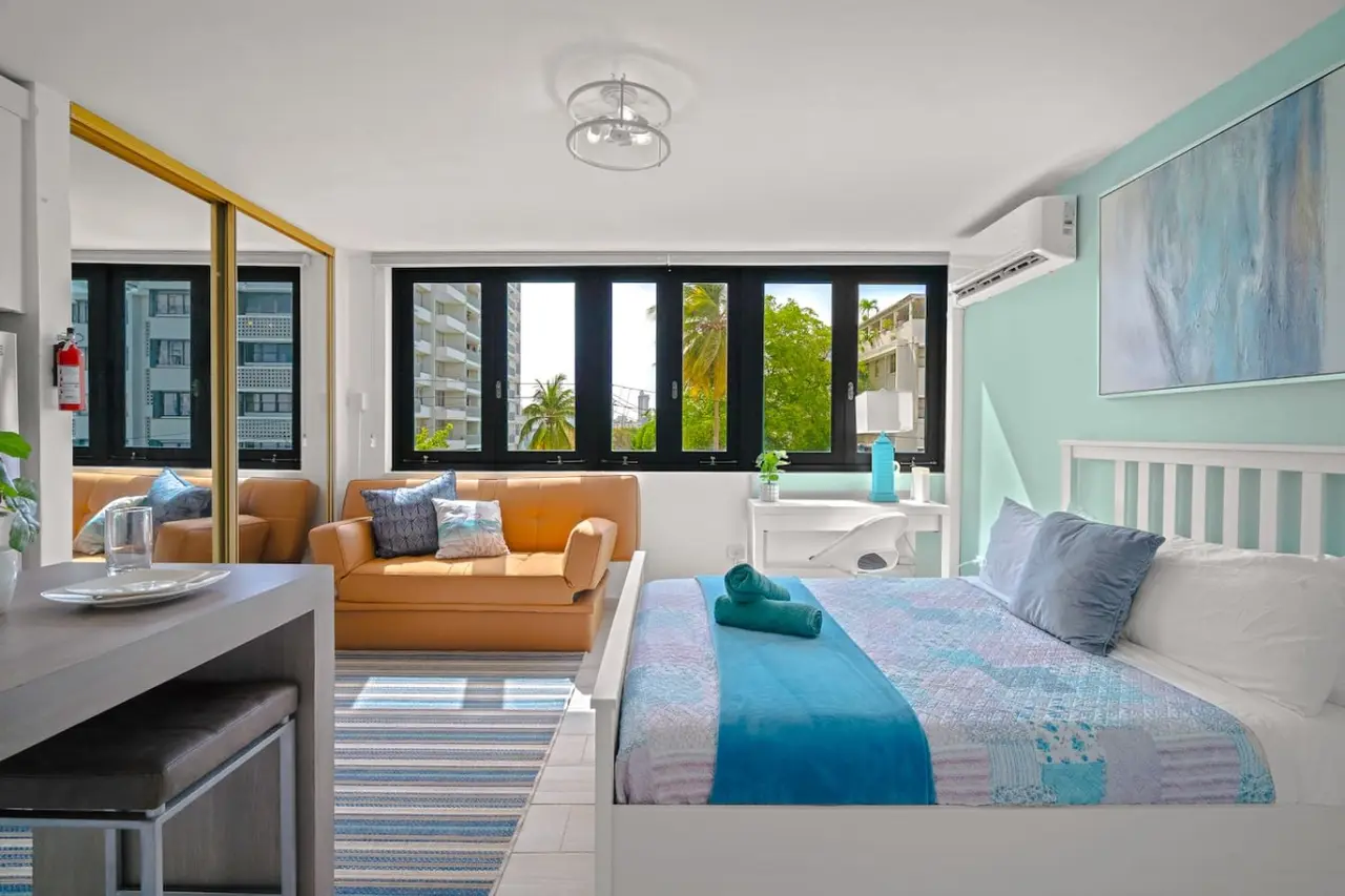 Bedroom with a blue bedspread — Casa Celeste | Sunlit Tropical Stay in Condado, Santurce