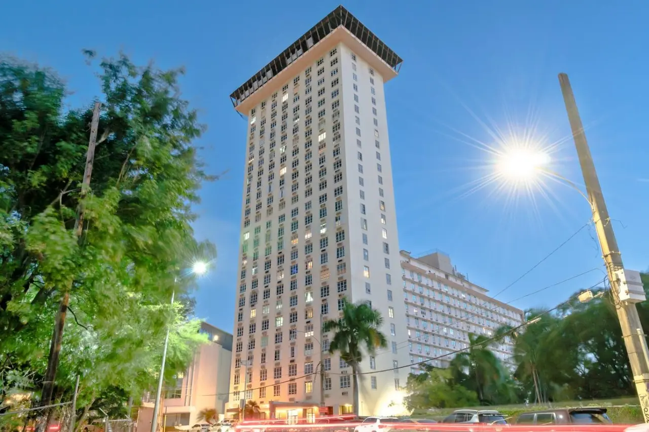 High-rise building, looking up from the street — T-Mobile District San Juan Next to Beach