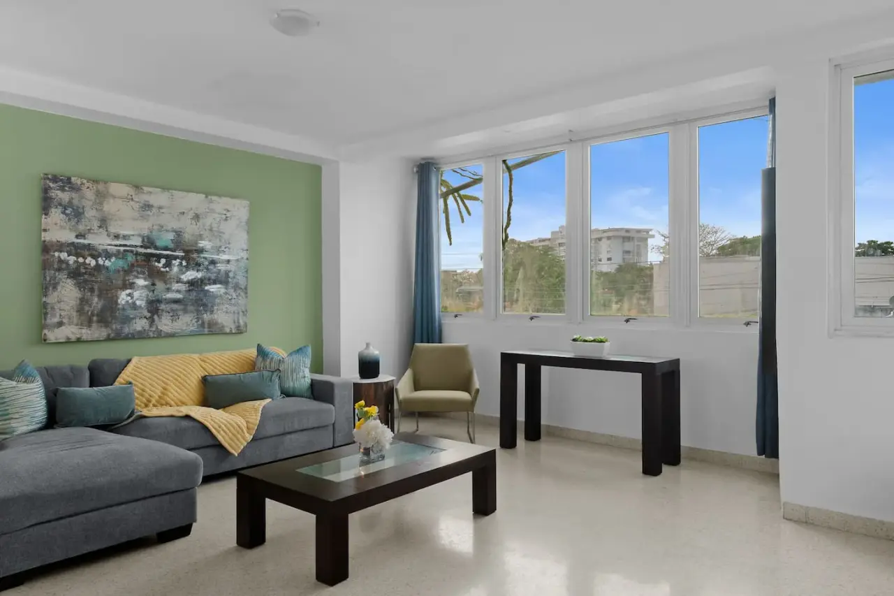 Living room with a couch, chair, and table — Maré 2BR | Near Ocean Park Beach + Laundry, Santurce