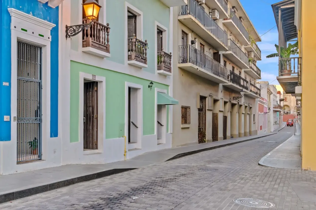 Cobblestone street with pastel buildings and balconies — Casa Esmeralda – Old San Juan