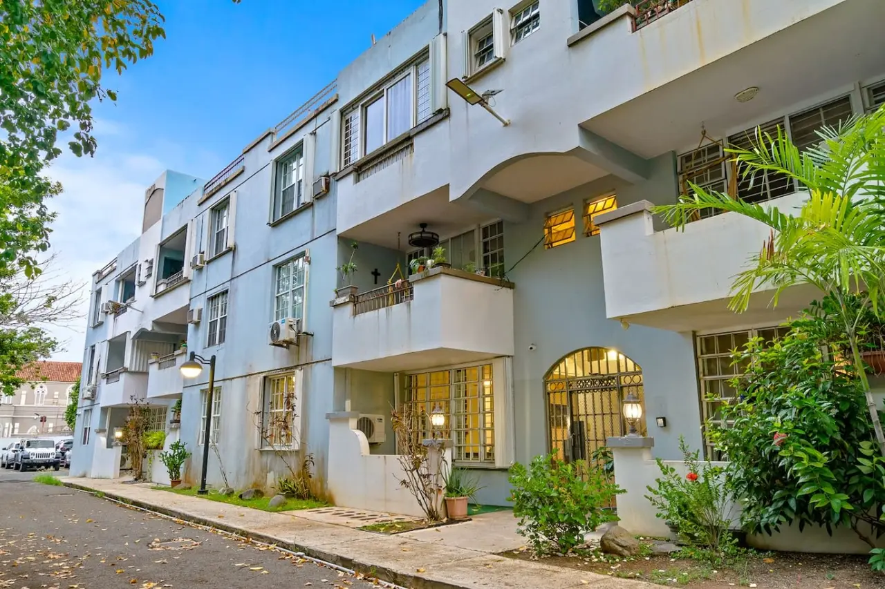 View of the balcony from the living room — The Castillo | Sleeps 8 | 2BR + Backyard & Parking, Santurce